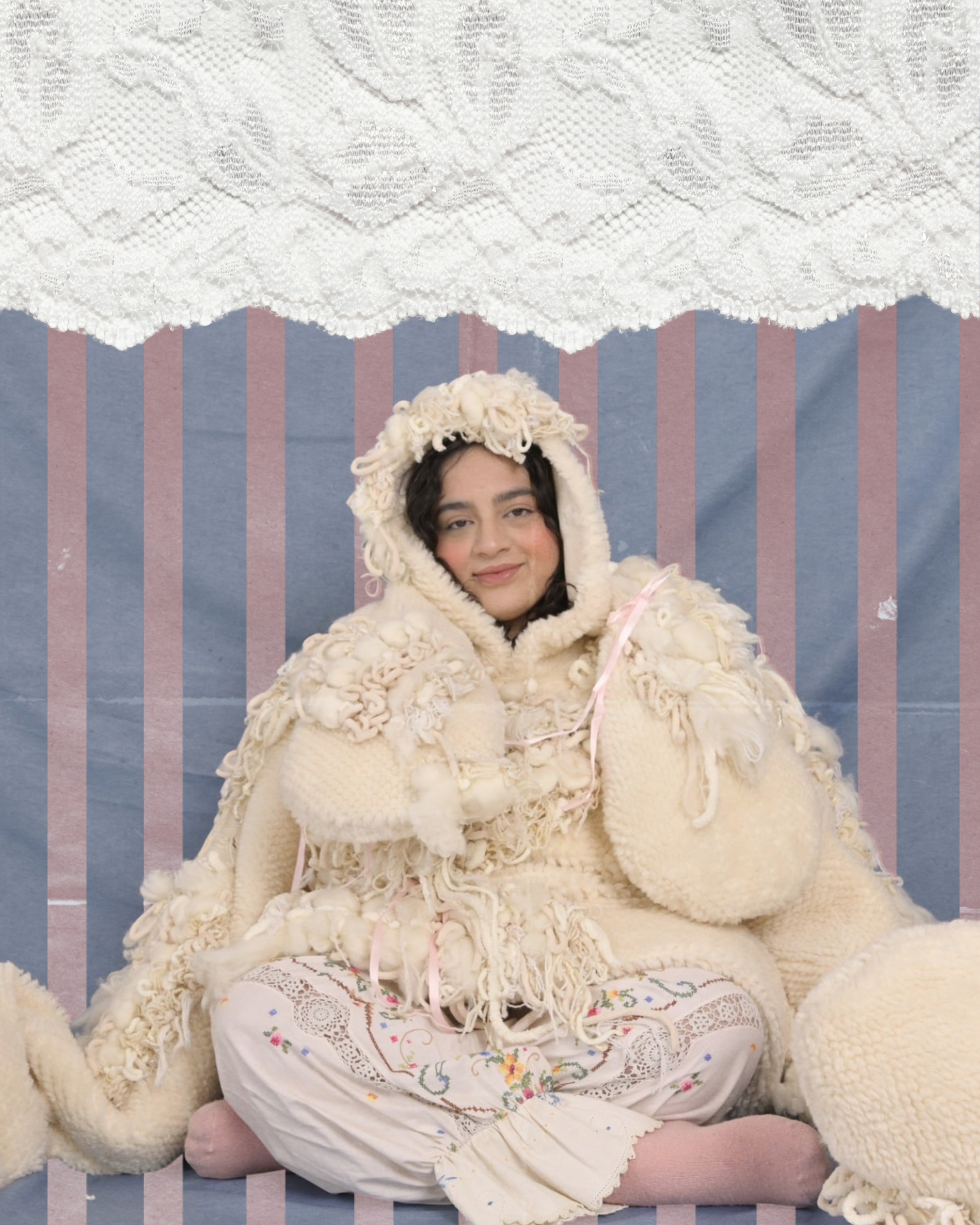 Final Thesis — plush cream hooded garment cross-legged